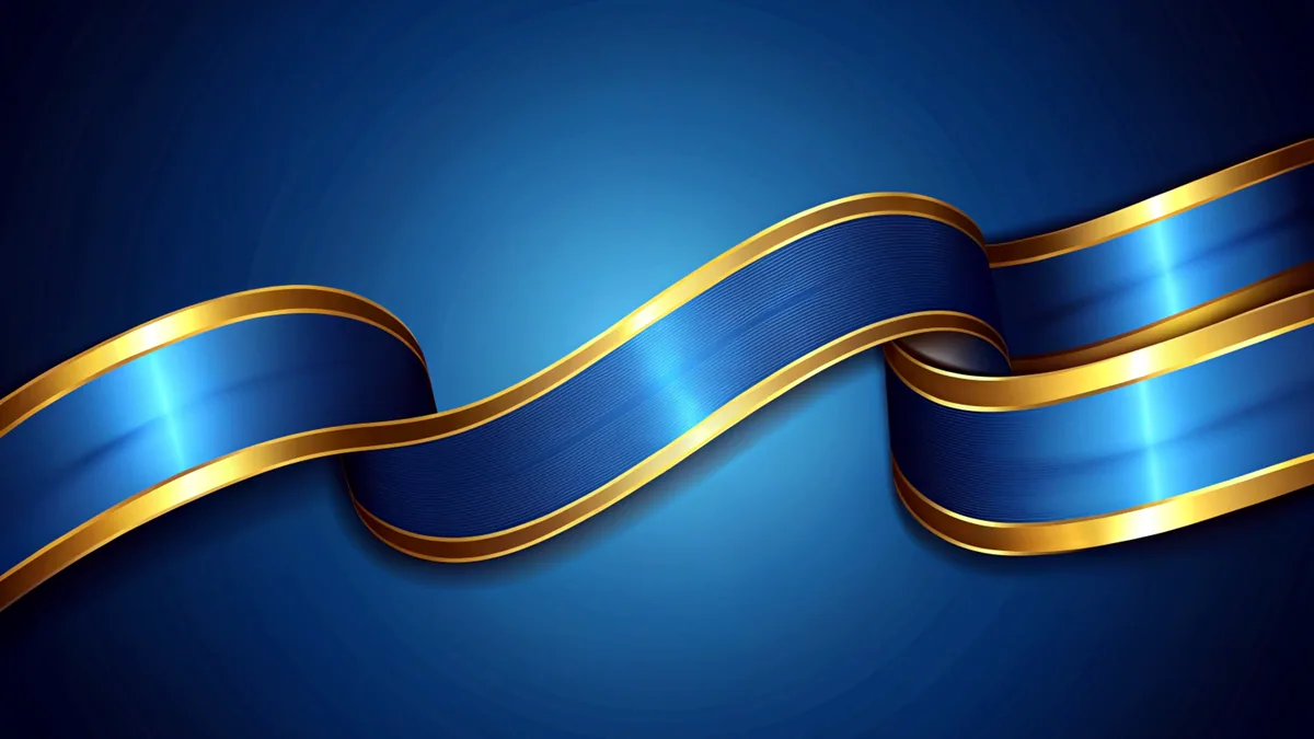 A small blue and gold awareness ribbon pinned to the collar of a light blue shirt.
